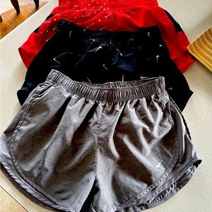 Women’s Nike running shorts, size medium.  Red and black pair no liner.